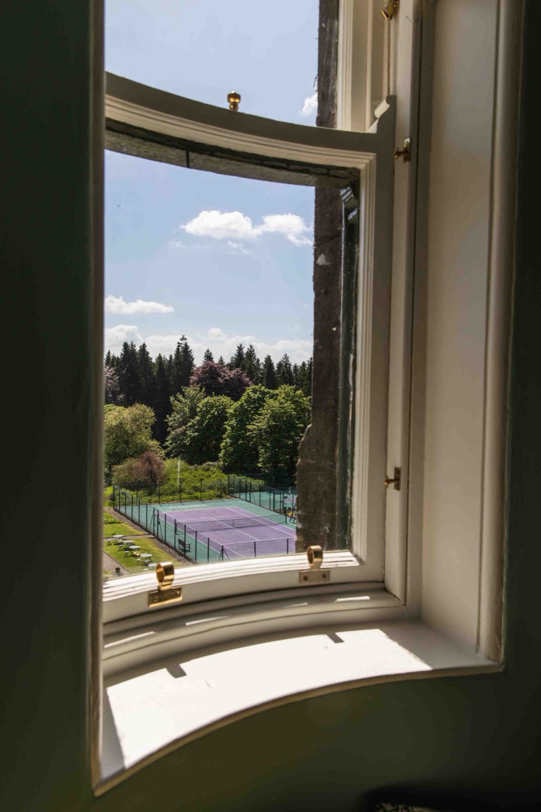 The tennis court at Cromlix seen from a guest room window